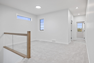 Bright bonus room with flexible space for office or play area in new home