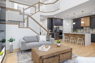 Bright and airy living room with minimalist decor in  a new build by Vita Homes