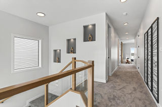 Elegant staircase with contemporary railing design in the Bellagio with Bar model