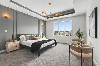 Master bedroom with indent ceiling and large windows in the Bellagio with Bar model by Vita Homes