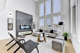 Spacious living room in the mirage model, featuring an open-concept layout with contemporary finishes