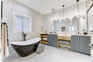 Modern bathroom in the mirage home, featuring sleek fixtures and flooring