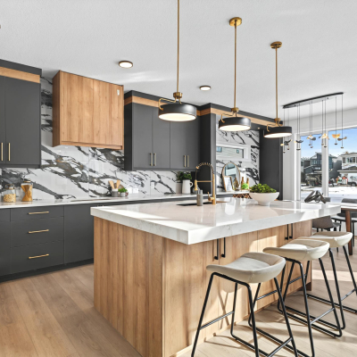 Open-Concept kitchen with end-to-end countertops and integrated bar area in the bellagio with bar floor plan